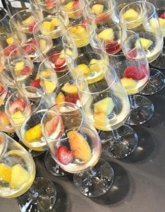 Sparkling Peach Sangria glasses garnished with fruit