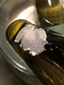 sticker residue on wine bottle
