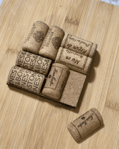 arrange wine corks on square tile