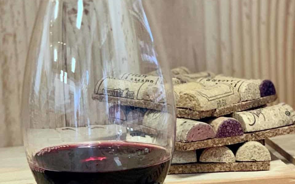wine glass on coaster made of wine corks