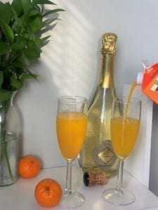 two glasses of mandarin mimosa