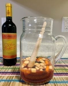 red wine sangria ingredients in pitcher