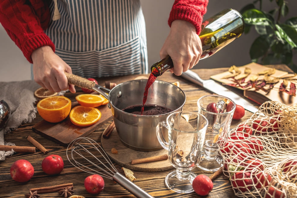person making mulled wine recipe
