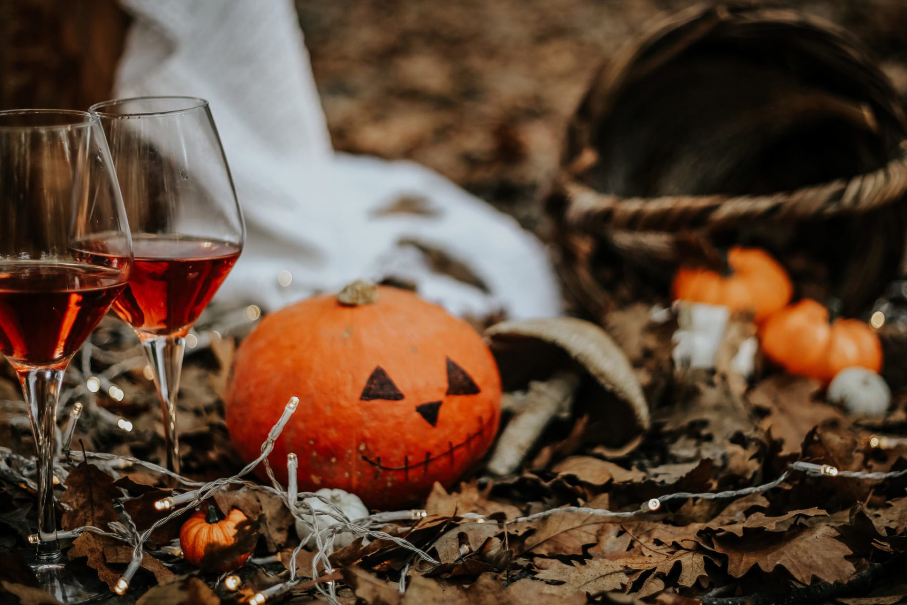 Two halloween wine glasses and a Halloween pumpkin