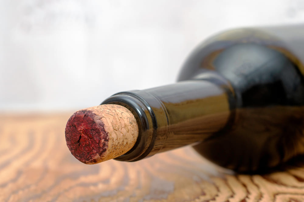 cork sticking out of wine bottle